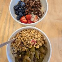 Hot oatmeal bowls with toppings. at Raw Press in South West London