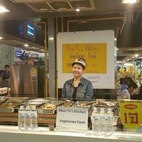 owner with food stall at Khun Ta J Food - Vegan Stall in Bangkok
