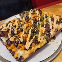 Tempeh of Doom pizza

Garlic oil, mozzarella, black beans, sweet potatoes, southwest tempeh, adobo sour cream drizzle, cilantro. (made vegan) at Pie-Sci in Detroit