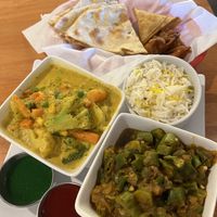 Vegan lunch with korma and okra, pakora, naan, samosas, rice and sauces  at Lazeez Indian-Mediterranean Grill in Las Vegas