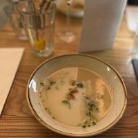 Salsify soup: A nice thick soup made from an uncommon (forgotten) vegetable with pickled cucumber and chives.  at BROEI in Utrecht