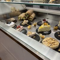 selection of cheesecakes in window   at #RAW VEGAN FIRENZE in Florence