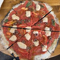 Margarita pizza with added olives oil  at #RAW VEGAN FIRENZE in Florence