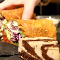 Wraps and raw vegan cakes. The chocolate was killing!  at #RAW VEGAN FIRENZE in Florence