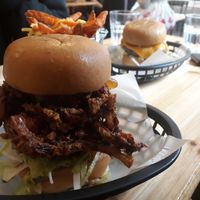 Brick Lane Bhaji burger with a Pulled mooshie and sweet potato cheesy fries at Mooshies in East London