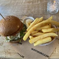 Vegan burger: the patty is a bit like a flat and round kroket with celleriac. It’s tasty and a bit sweet. The fries are very good as well. at Natuurlijk in Egmond Aan Zee