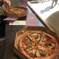 Pizza and window seat  at Bella&Brava in Venice
