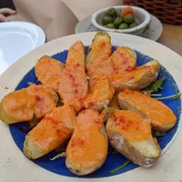 Papas con mojo sobre cama de brotes verdes at Califa Tapas in Vejer De La Frontera