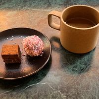 Coffee with caramel chocolate praline and berry ball  at Pepstop - Riddargatan in Stockholm