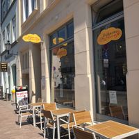 view on the street (but it is not very busy) at Werners Eiscafe in Wismar