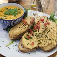 Soup with bread and peanut sweet potato hummus + side salad at Kitchen Garden in Bordeaux