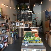 Inside the market with a view of the juice/smoothie menu at Celis Produce in West Palm Beach