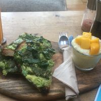 Orange and turmeric juice, avo and pesto on toast and mango sticky rice  at Beet Bar in Margate