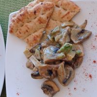 Warm starter dish: Mushrooms with avocado in soy cream and Pita bread. Very yummy. at Sea Vibe in Santorini