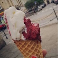 half eaten vegan malibu and forest fruit flavour on a gluten free cone at Good Lood in Krakow