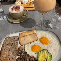 Vegan breakfast and iced oat latte, coconut cappuccino and gluten/ dairy free waffles   at The Sister in Brussels