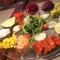 Antipasti plate with a bunch of hummus, dried tomatoes, ... at The Sister in Brussels