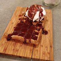 Vegan waffle with soy vanilla ice cream and vegan chocolate sauce at The Sister in Brussels