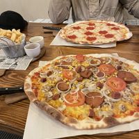Vegan sausage, salami, tomato, onion, mushroom and cheese  at Pizza Loft in Krakow
