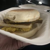 Breakfast muffin with square sausage, tattoo scone, cheeze and scrambled “egg” (not sure what’s in it)  at Rose & Grant's in Glasgow