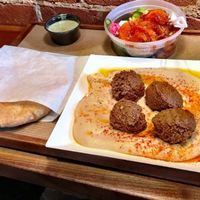 Hummus plate is served with warm pita. We added falafels and a side of veggies. Pro tip: we got the veggies "on the house" because it was our first time trying Brassica.  at Brassica in Columbus