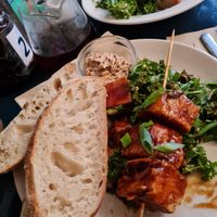 Tofu skewers, sour dough bread with medjool date butter and garlic and lemon kale. at The Old Electric Shop in Hay-on-wye