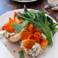 Carrot lox and cashew cream cheese on muffins. Salad was fresh. at The Old Electric Shop in Hay-on-wye