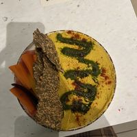 Turmeric hummus with seed crackers   at Stem & Glory in Cambridge