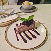 Desserts - almond & pear crumble
with vanilla ice cream (in the background)
and
raw raspberry cheese cake with berry compote #Veganuary at Stem & Glory in Cambridge
