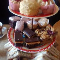 Vegan afternoon tea tier of cakes and sandwiches at Hidden Lane Tea Room in Glasgow