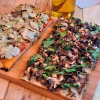 Truffle and antipasti pizzas at Hank Vegan Pizza in Paris