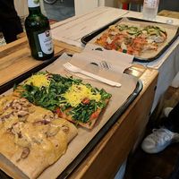 Four vegan pizzas and vegan beer. at Hank Vegan Pizza in Paris