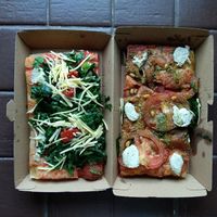 Two pizzas i brought back home, not enough stuff on it i think. at Hank Vegan Pizza in Paris