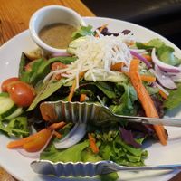 Salad with non-dairy cheese at Patxi's Pizza in Santa Barbara