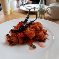 tomato bread bake with capers and kale at Riverside Sourdough Cafe @ the embassy in Cardiff