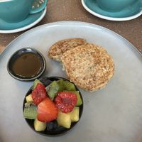 Vegan pancakes with maple syrup and fruits  at Mr. Fox in Riga