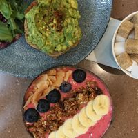 Smoothie bowl with granola and avocado toast  at Mr. Fox in Riga