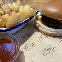 Vegan cheeseburger and chips  at The Perch in Oxford
