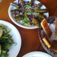 Stuffed champis, dolmades, garlic bread at Milos Taverna in Crete