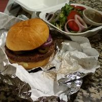 Build-Own-Burger with optional vegan Impossible burger. Ordered with salad, a premium side. at Wild Flower Cafe in Red Hook
