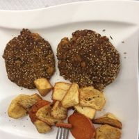 really greasy food, they called this chickpea pancakes. It was impossible to eat.  at Natu in Santander