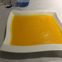 This is a carrot soup serve in dated square style dish, it didn't taste of carrot.  at Natu in Santander