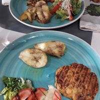 Chickpea burger, roasted potatoes and salad. 'Chiken' made with soya in a delicious sauce, roasted potatoes and salad. at Natu in Santander