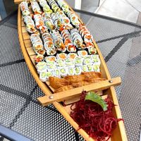 Three vegan party platters on a sushi boat 🍣🍱  at Sushi 101 Bar & Grill in Tempe