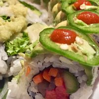 Garden Fire Roll: Fresh asparagus, kanpyo, carrots, red pepper, avocado, jalapeño and hot sauce at Sushi 101 Bar & Grill in Tempe