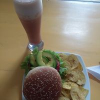 Quinoa burger and ginger and hibiscus juice.  at Cafe Tropico in Taganga