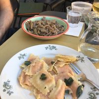 Pumpkin Ravioli with “butter” sage sauce and spelt pasta with porcini mushrooms sauce.  at In Pasta in Lucca