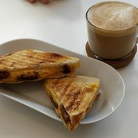 Vegan cheese and seitan toastie and flat white at Blanche Bakery in Cardiff