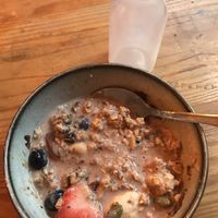 The empty oat milk bottle I’d had to ask for to make the ‘porridge’ bowl edible    at Tofurei in Norwich