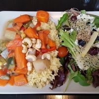 Dish of the day: quinoa with vegetables and salad with grapes and blueberries at De Plaats in Bruges